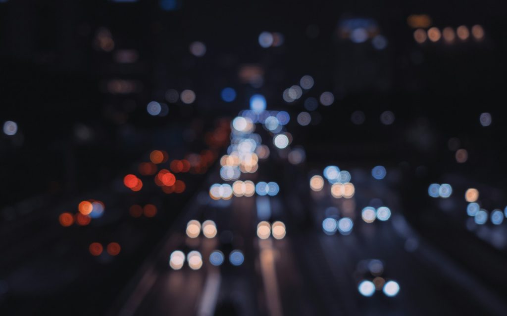 A blurry photo of a city street at night