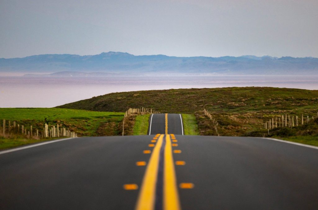 a road with a yellow line on the side of it
